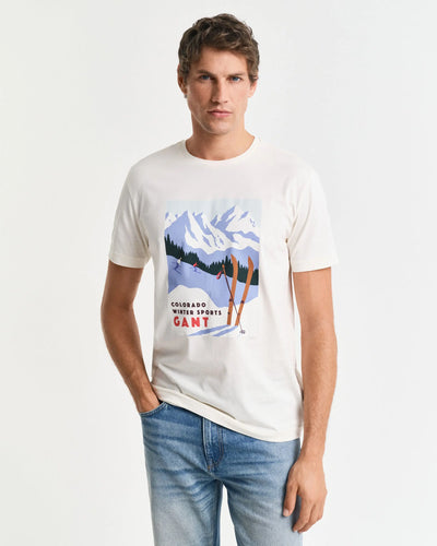 T-shirt από βαμβάκι με λαιμόκοψη και στάμπα χειμερινών σπορ.
